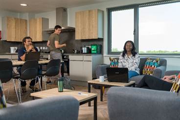 A group of people in a room

AI-generated content may be incorrect.