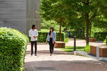 A person and person walking on a path

AI-generated content may be incorrect.